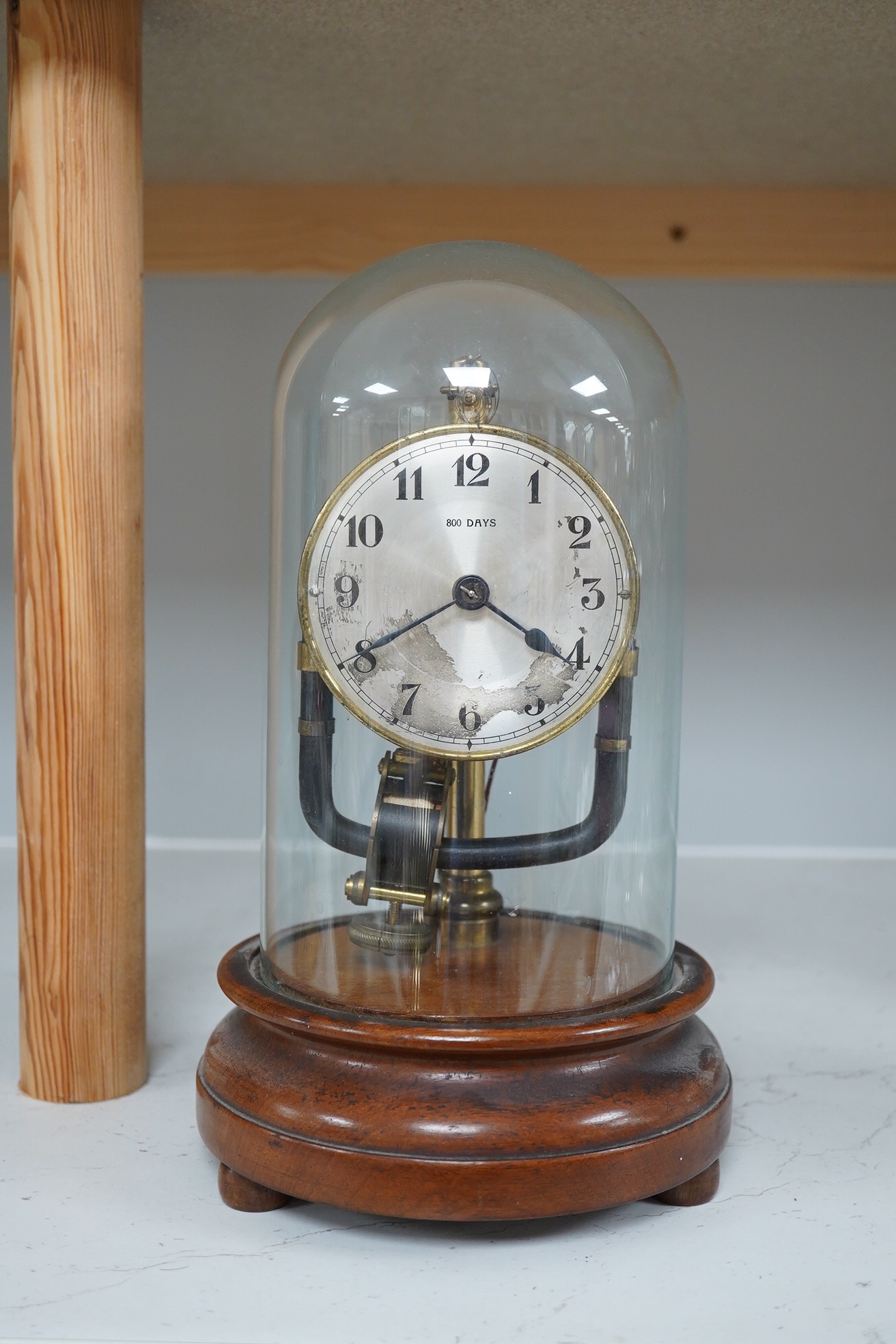 A Bulle type electric 800 day timepiece under dome, 26cm. Condition - worn, not tested